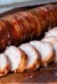 A delicious BBQ recipe of bacon wrapped smoked pork tenderloin with cajun seasoning.