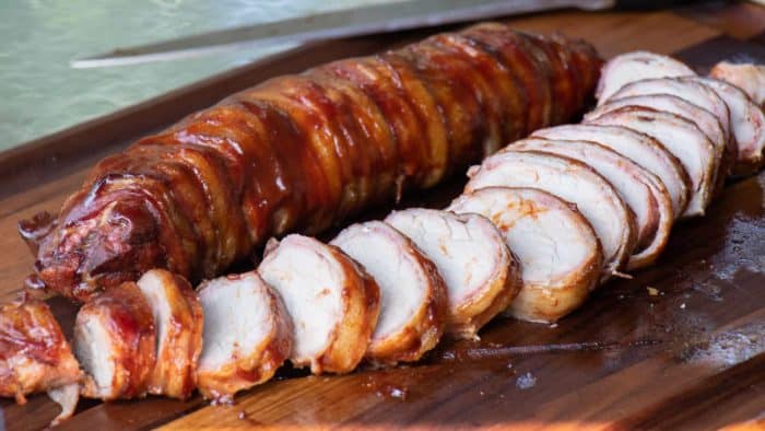 A delicious BBQ recipe of bacon wrapped smoked pork tenderloin with cajun seasoning.
