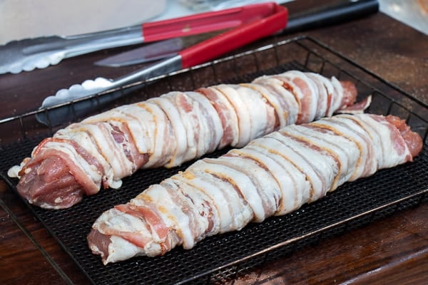 A delicious BBQ recipe of bacon wrapped smoked pork tenderloin with cajun seasoning.