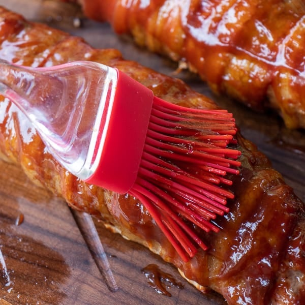 A delicious BBQ recipe of bacon wrapped smoked pork tenderloin with cajun seasoning.