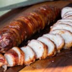 A delicious BBQ recipe of bacon wrapped smoked pork tenderloin with cajun seasoning.