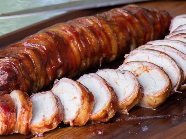 A delicious BBQ recipe of bacon wrapped smoked pork tenderloin with cajun seasoning.