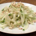 A fresh salad made with fennel, pear and pine nut salad with an orange and honey vinaigrette dressing.