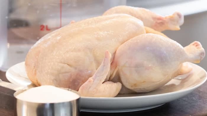 Easy instructions to make a simple brine for a whole chicken including how long to brine and what ingredients to add to the water including salt, sugar, pepper.