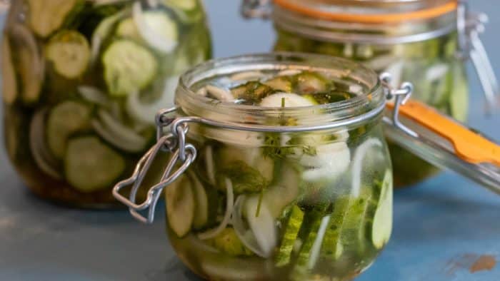 How to make refrigerator pickles with this simple recipe. Sweet and tangy, these dills have a crispy crunch with each bite.