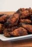 Sweet Thai Chili Smoked Chicken Wings Recipe - Simple instructions for how to smoke chicken wings with a delicious rub and a sweet and sticky Thai chili glaze.