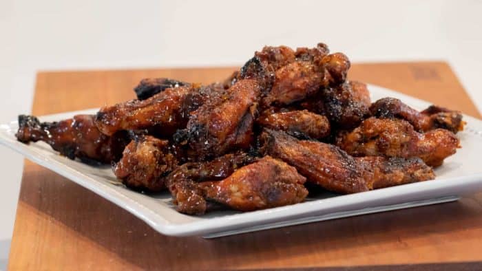 Sweet Thai Chili Smoked Chicken Wings Recipe - Simple instructions for how to smoke chicken wings with a delicious rub and a sweet and sticky Thai chili glaze.