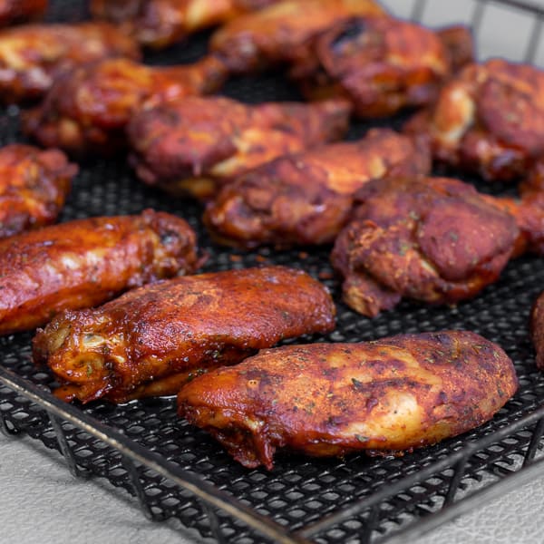 Simple instructions for how to smoke chicken wings with a delicious rub and a sweet and sticky Thai chili glaze.