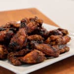 Simple instructions for how to smoke chicken wings with a delicious rub and a sweet and sticky Thai chili glaze.