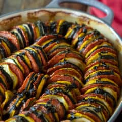 This oven baked ratatouille recipe is a classic French Tian side dish. Made with tomatoes, eggplant, green and yellow zucchini, this is a hearty fall meal.