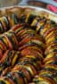 This oven baked ratatouille recipe is a classic French Tian side dish. Made with tomatoes, eggplant, green and yellow zucchini, this is a hearty fall meal.