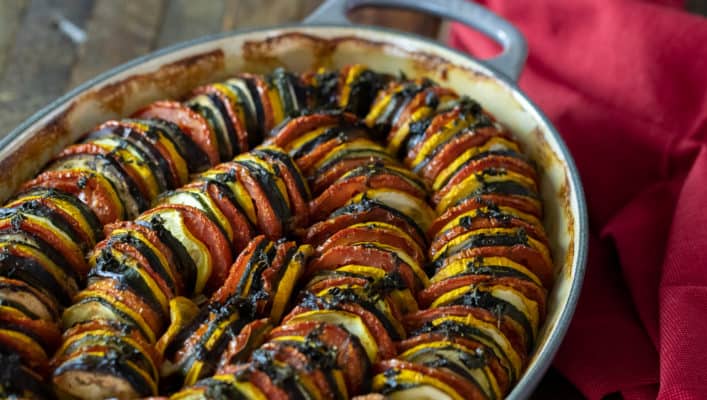 This oven baked ratatouille recipe is a classic French Tian side dish. Made with tomatoes, eggplant, green and yellow zucchini, this is a hearty fall meal.
