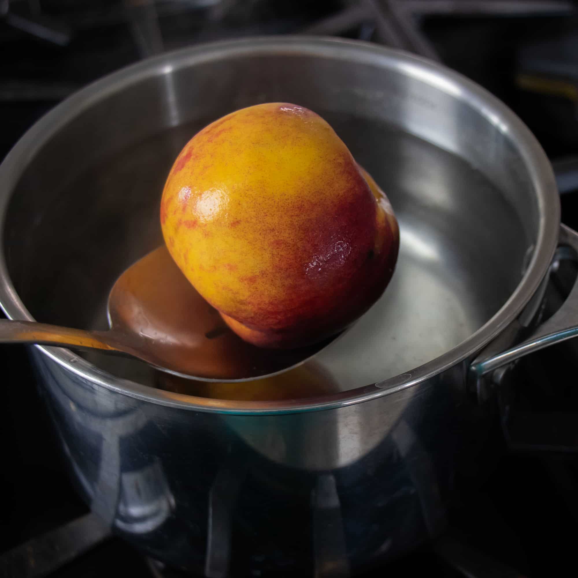 Take the peaches out with a slotted spoon