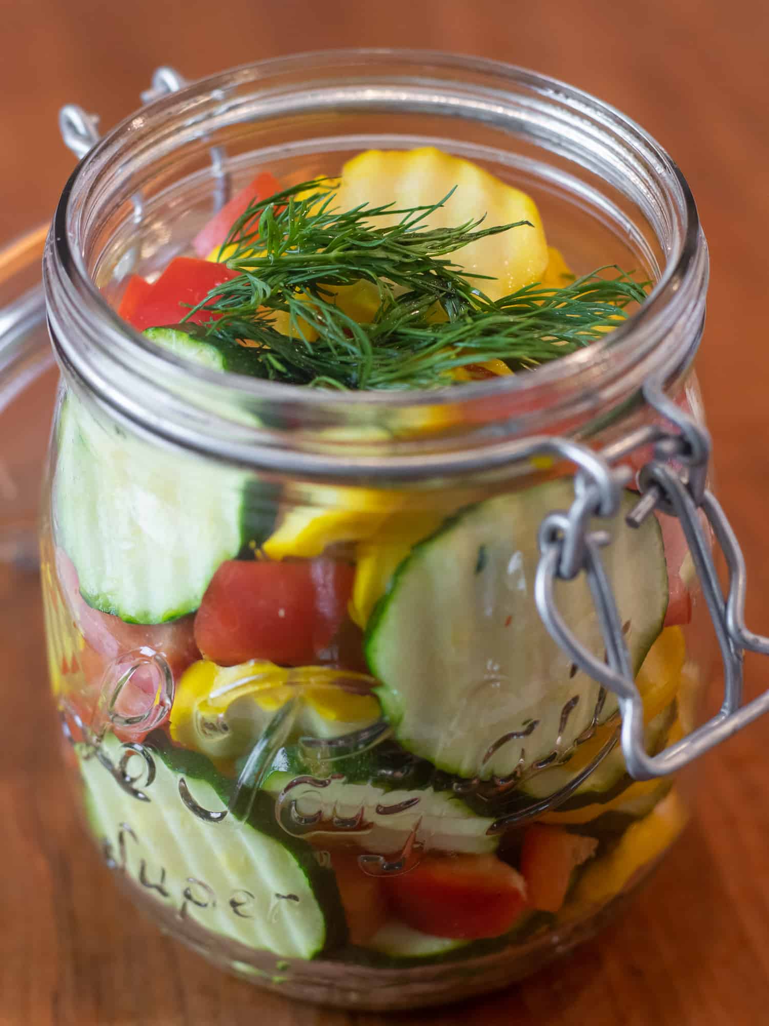 Pack jar with sliced zucchini and diced pepper.