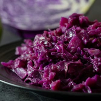 A finished photo of the red cabbage and apples that were braised in a dutch oven.