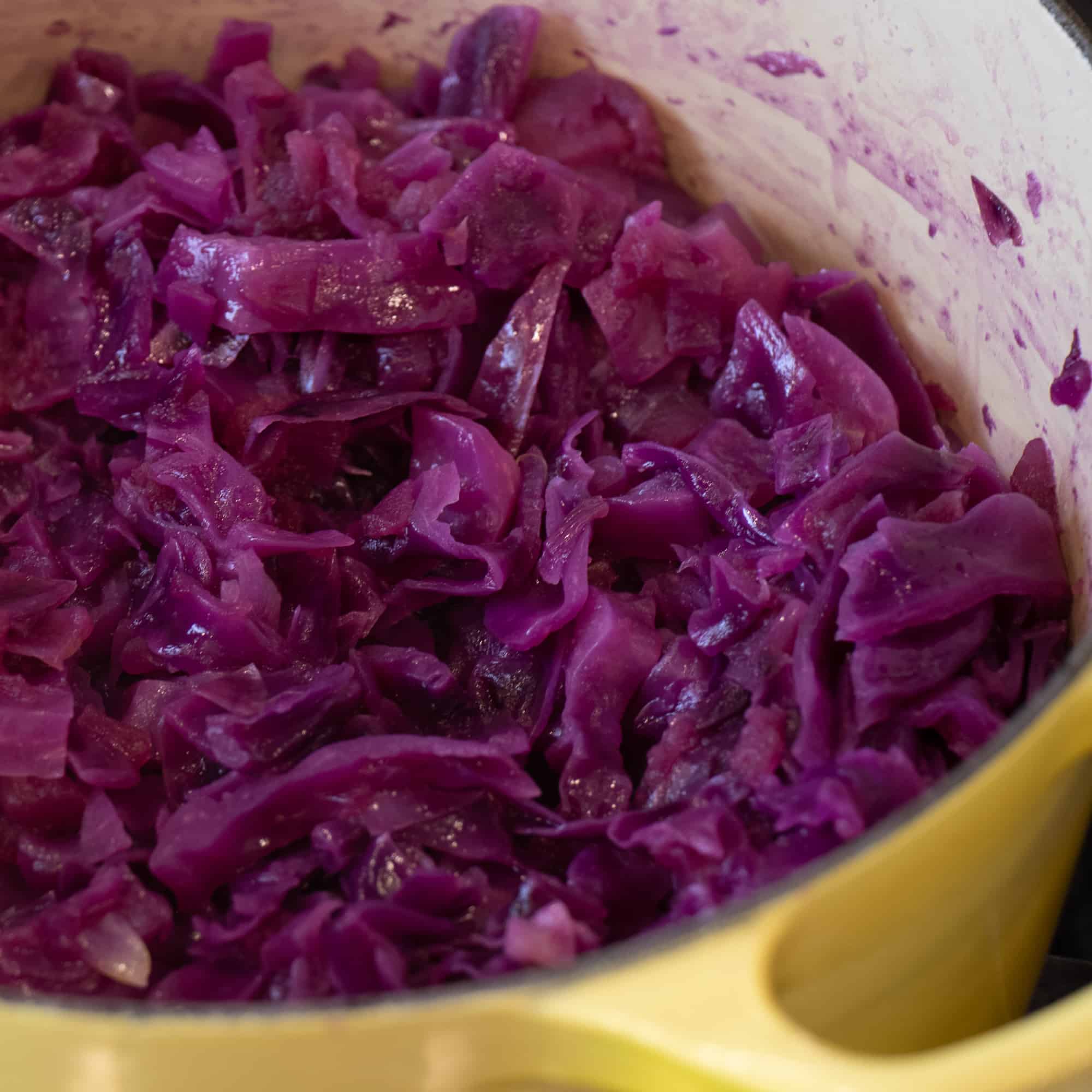 After the cabbage and apples have simmered on the stove for 45 to 60 minutes, the colour is a deep purple and the cabbage is soft and sweet.