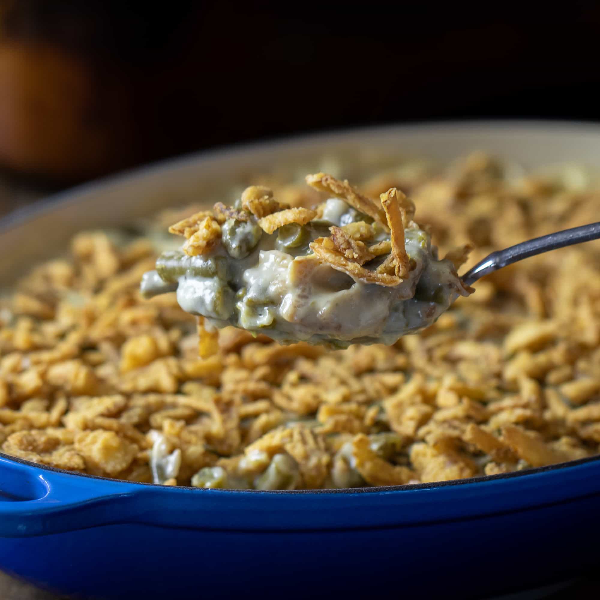 Traditional green bean casserole recipe made with cream of mushroom soup and crispy fried onions. The best holiday Thanksgiving side dish.