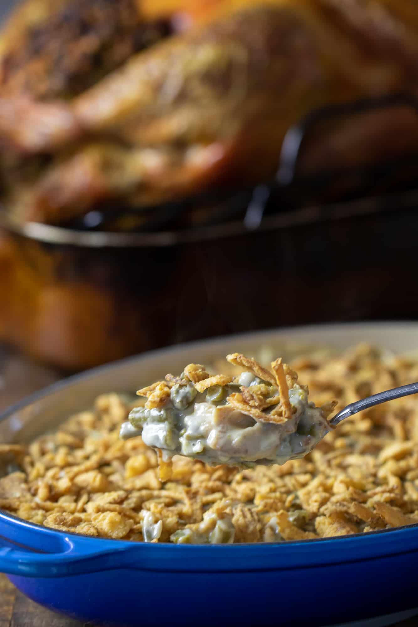 Traditional green bean casserole recipe made with cream of mushroom soup and crispy fried onions. The best holiday Thanksgiving side dish.