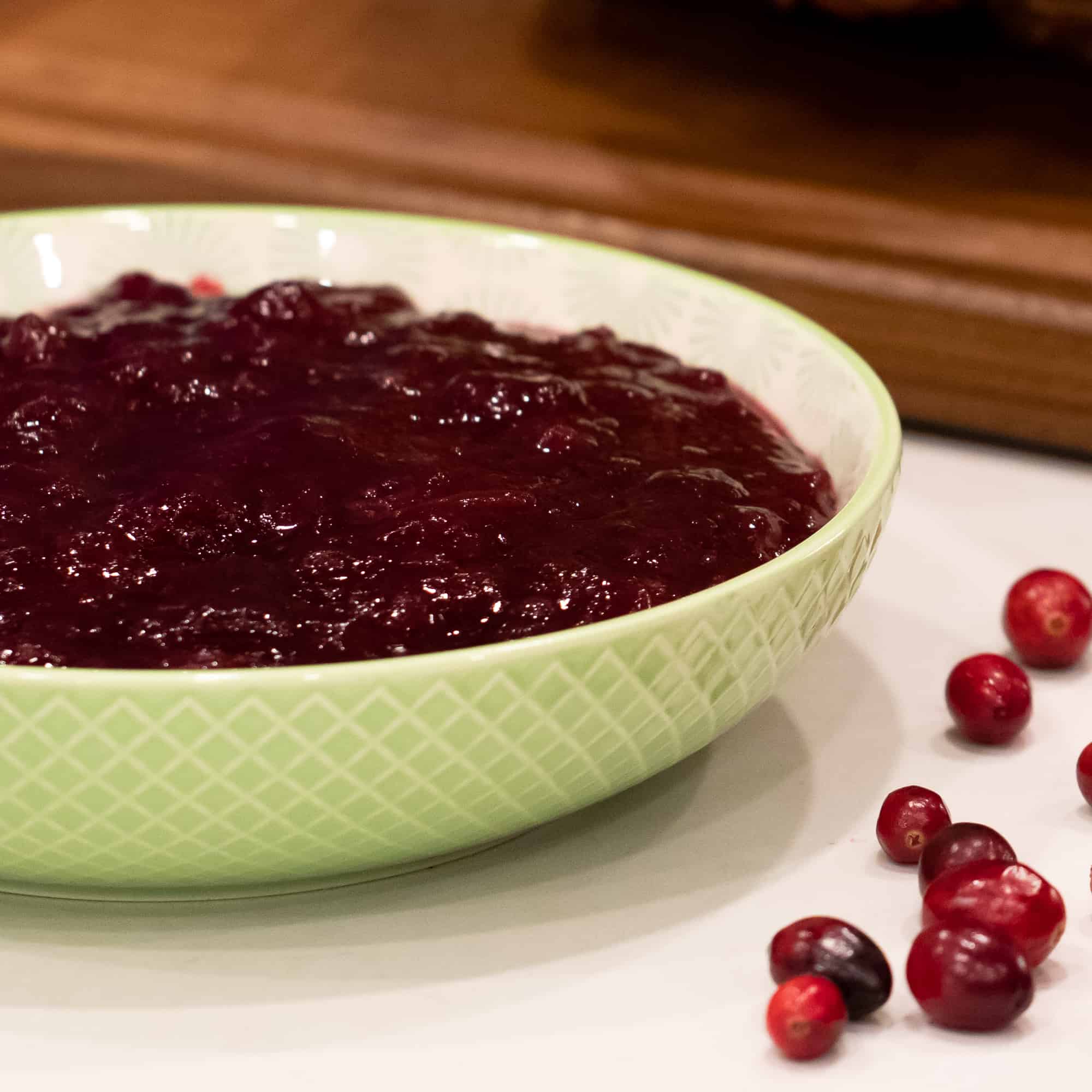Easy recipe and instructions for how to make homemade cranberry sauce with fresh cranberries. Perfect condiment for thanksgiving or christmas turkey dinner!