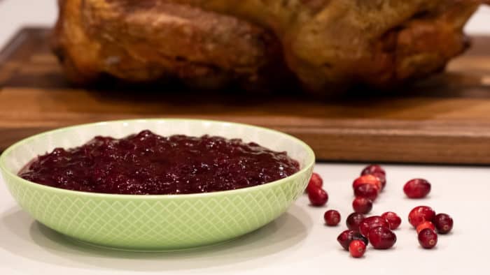 Easy recipe and instructions for how to make homemade cranberry sauce with fresh cranberries. Perfect condiment for thanksgiving or christmas turkey dinner!