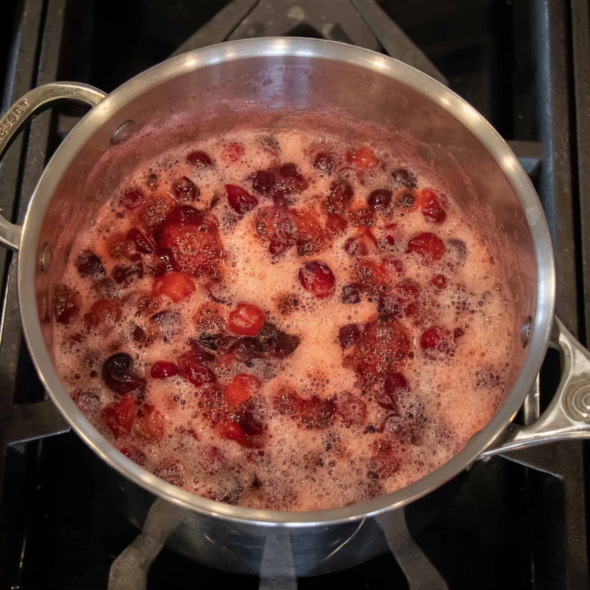 Continue to simmer until the cranberries crack and the sauce thickens.