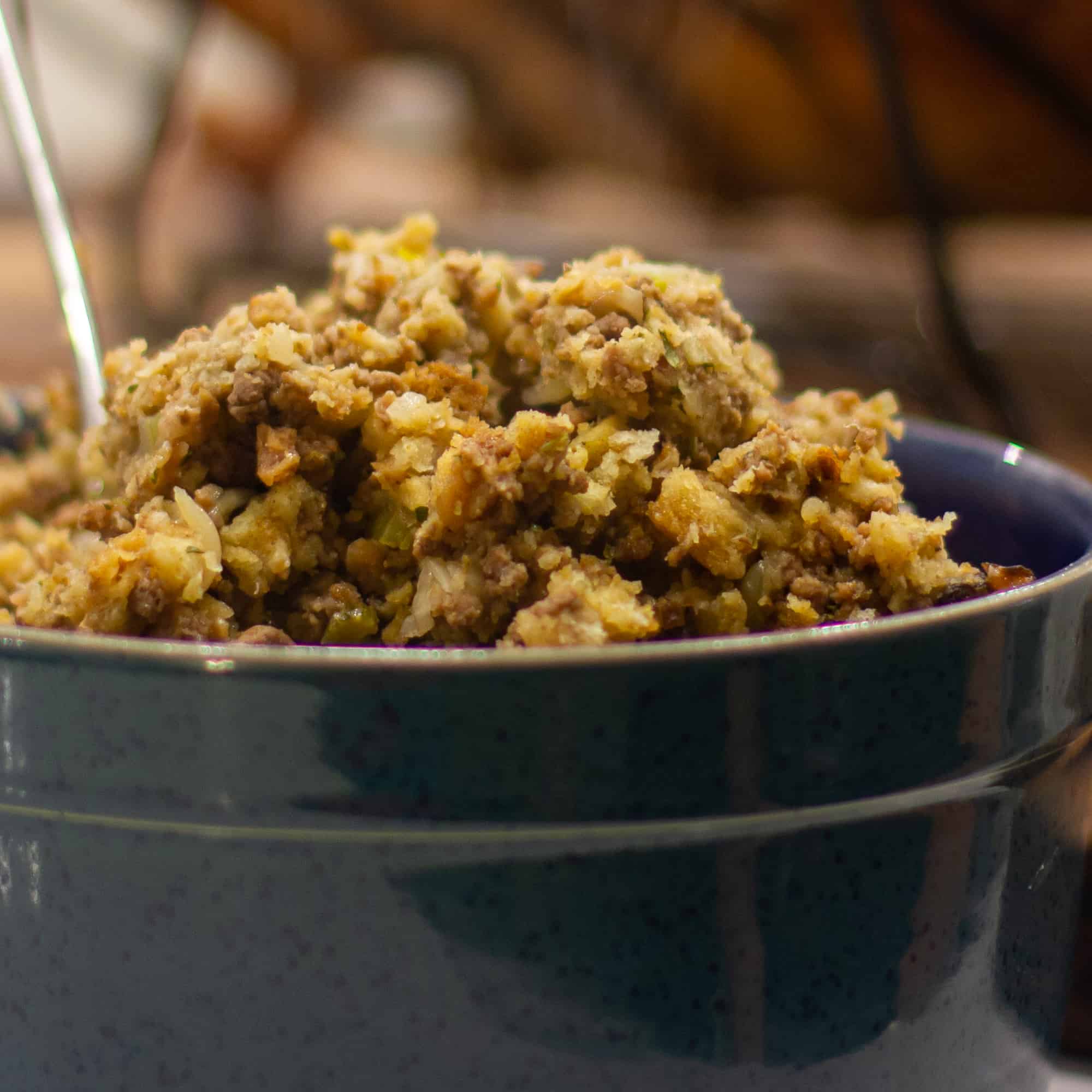 Scoop the stuffing out of the turkey and spoon into a bowl