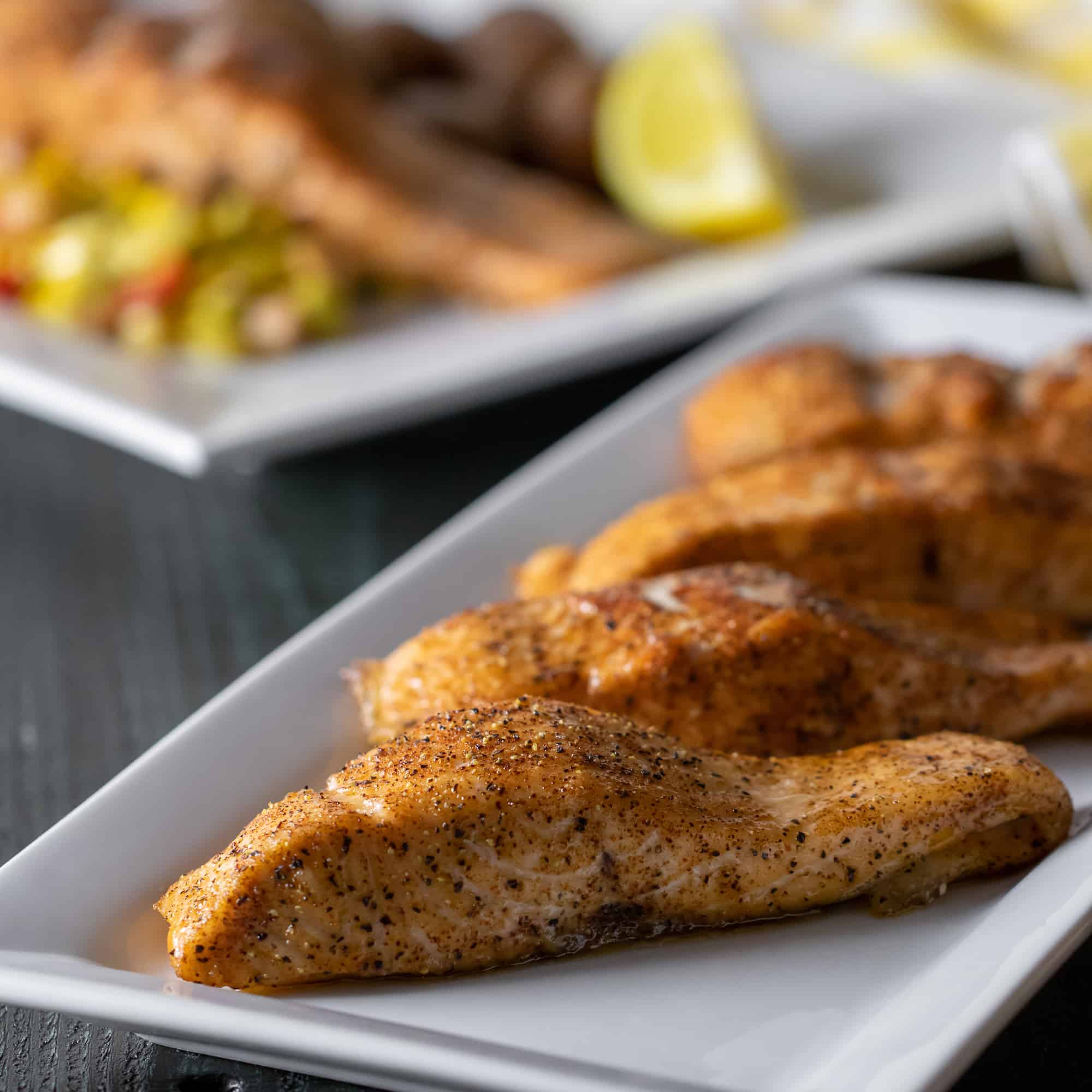 Plate of baked salmon fillets.