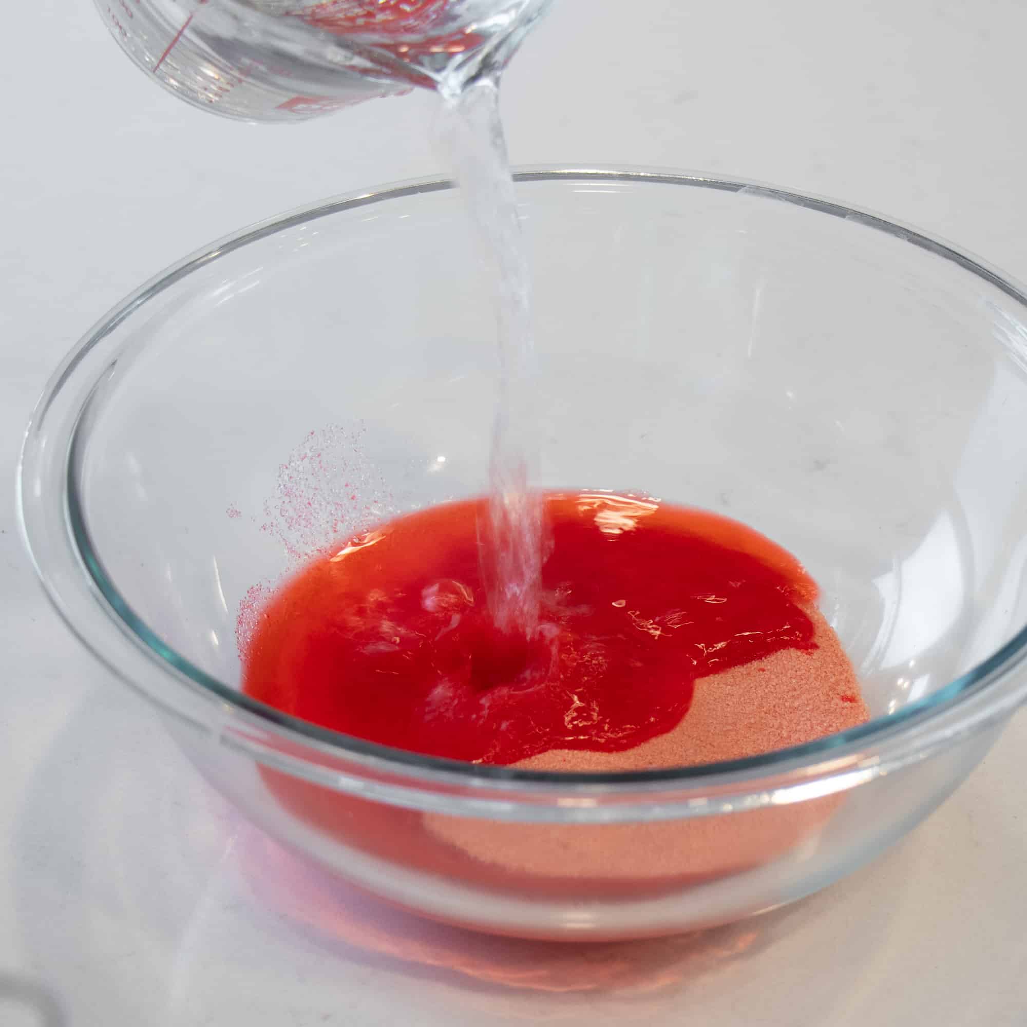 Dissolve the Jello crystals with boiling water.