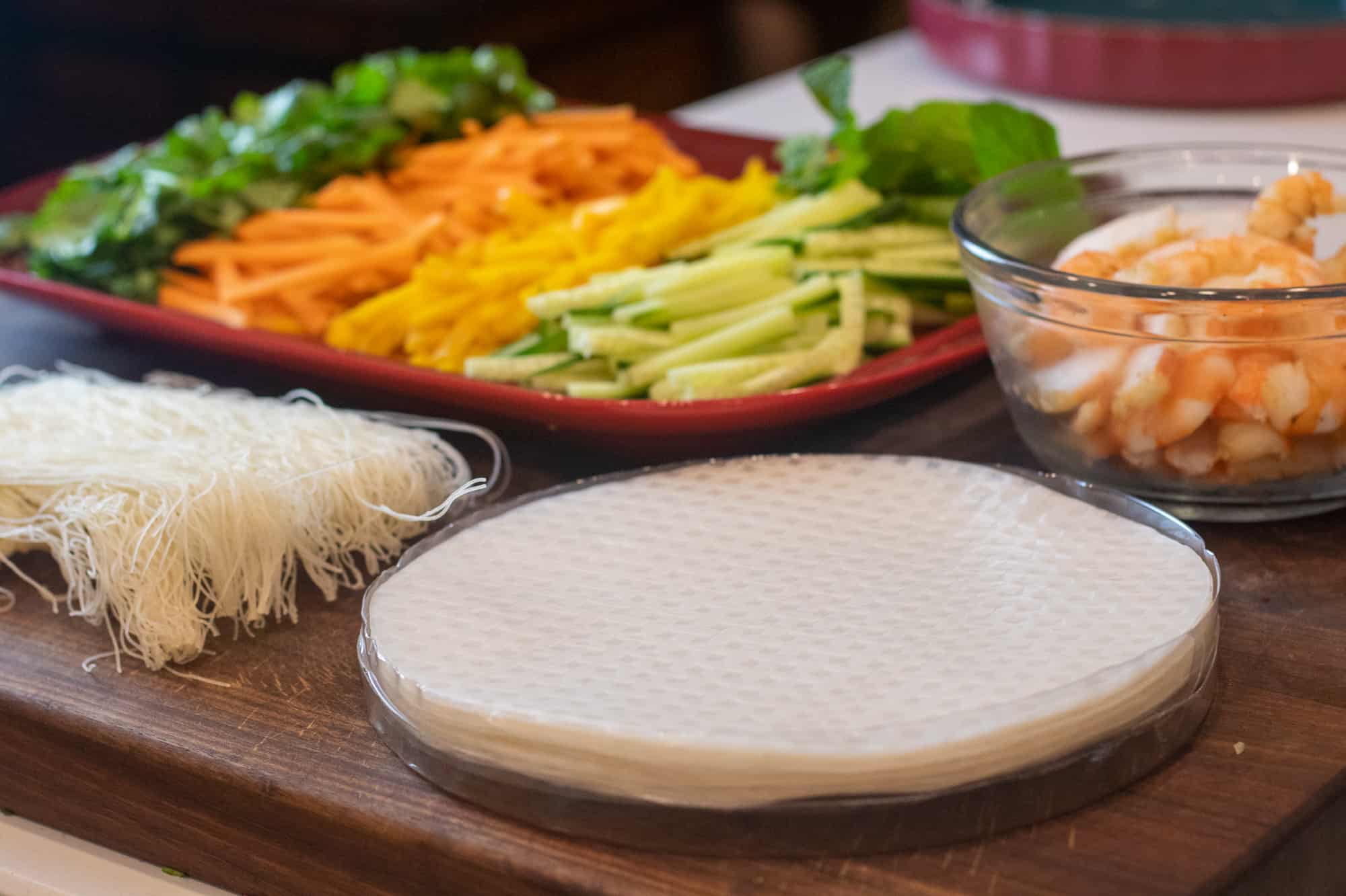 Preparation of ingredients with julienned vegetables and mango