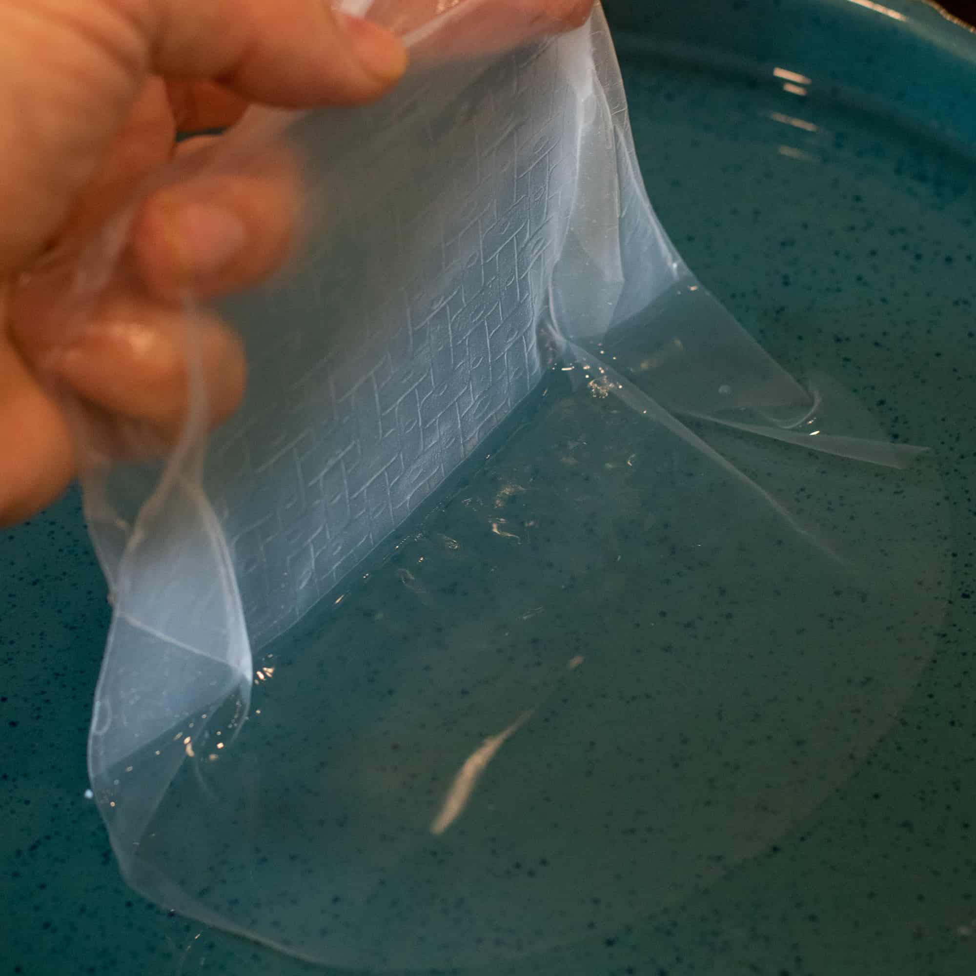 After the rice paper has soaked for about a minute, lift out of the bowl.