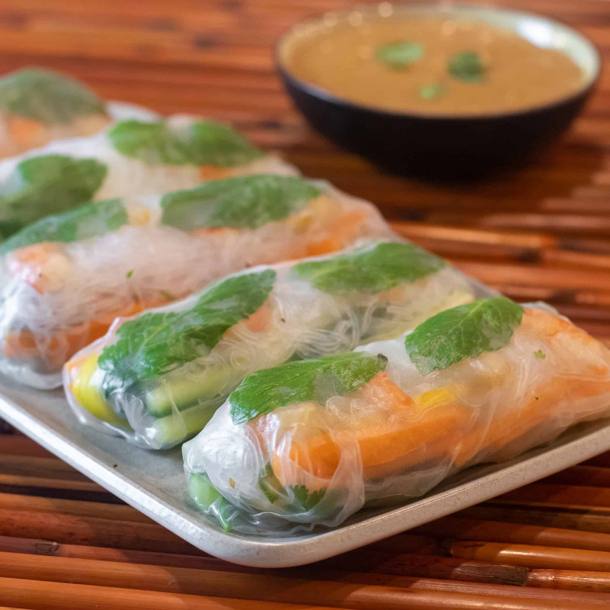Serve the cold spring rolls with peanut sauce.
