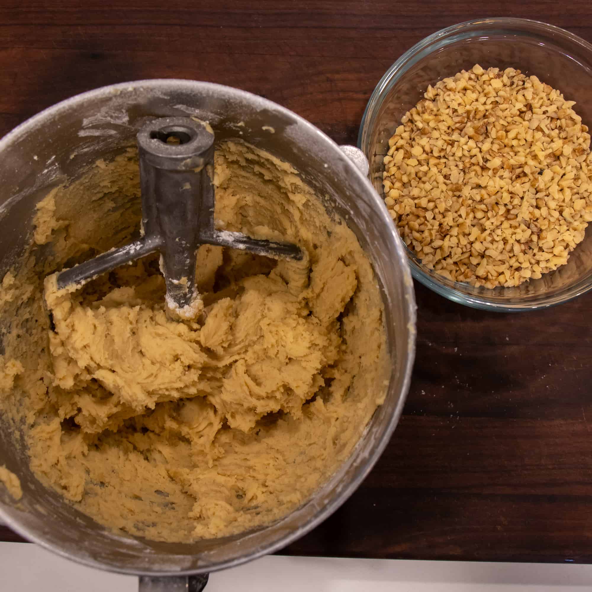 Make the dough with an electric mixer and have it ready along with a bowl of chopped walnuts.