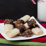 A plate of shortbread cookies dipped in chocolate with Skor toffee bits