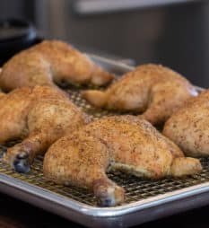 Easy recipe and instructions for baked chicken leg quarters with a simple Italian herb and garlic seasoning. Whole leg quarters include drumstick and thigh.
