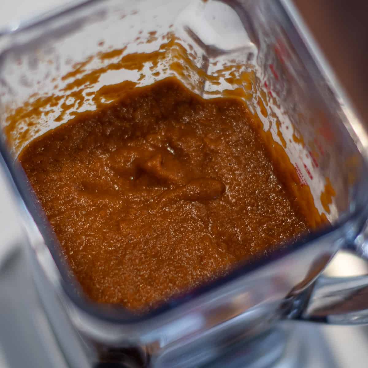 A picture of the smooth consistency of the sauce after it has blended.
