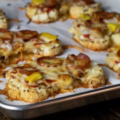 Cauliflower steaks topped with pizza sauce, pepperoni and cheese.