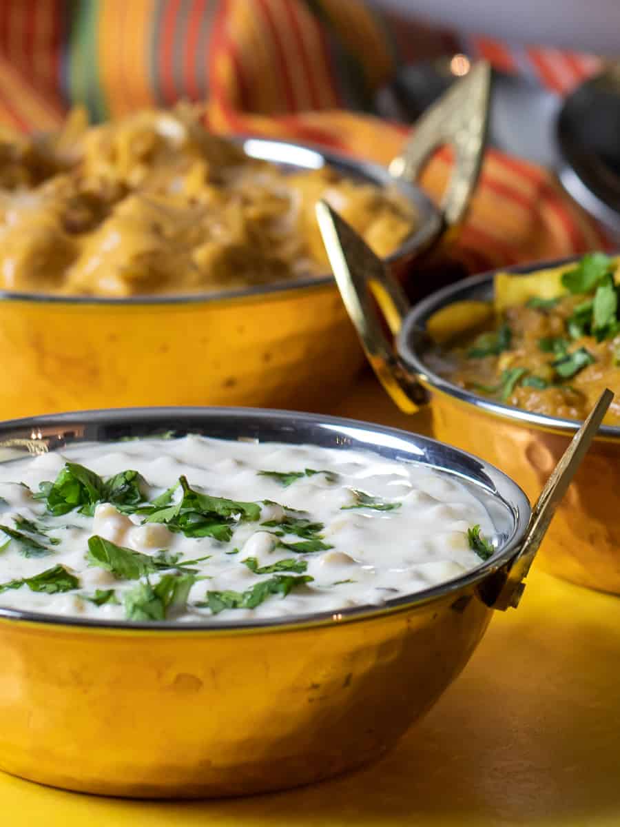 Multiple Indian dishes displayed next to each other.