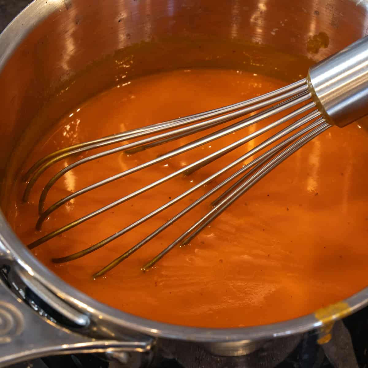 Making the buffalo sauce on the stovetop.