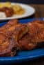 A platter full of pork chops.
