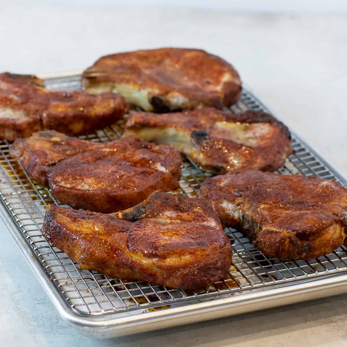 A baking sheet of chops that are done and ready to eat.