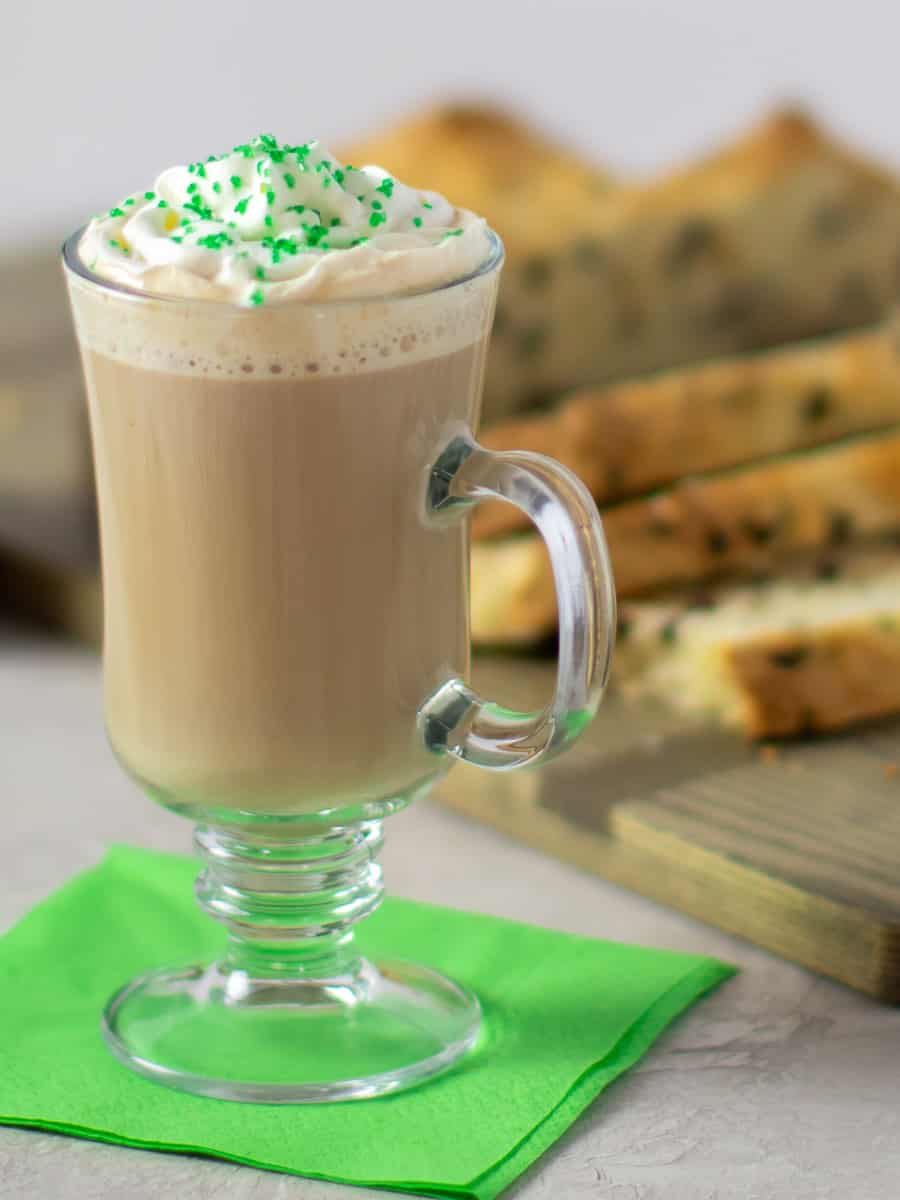 A tall image of coffee with whipped cream.