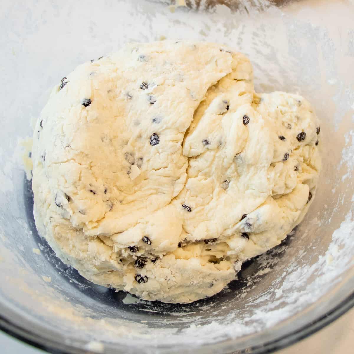 Bread dough gently kneading and in a bowl.