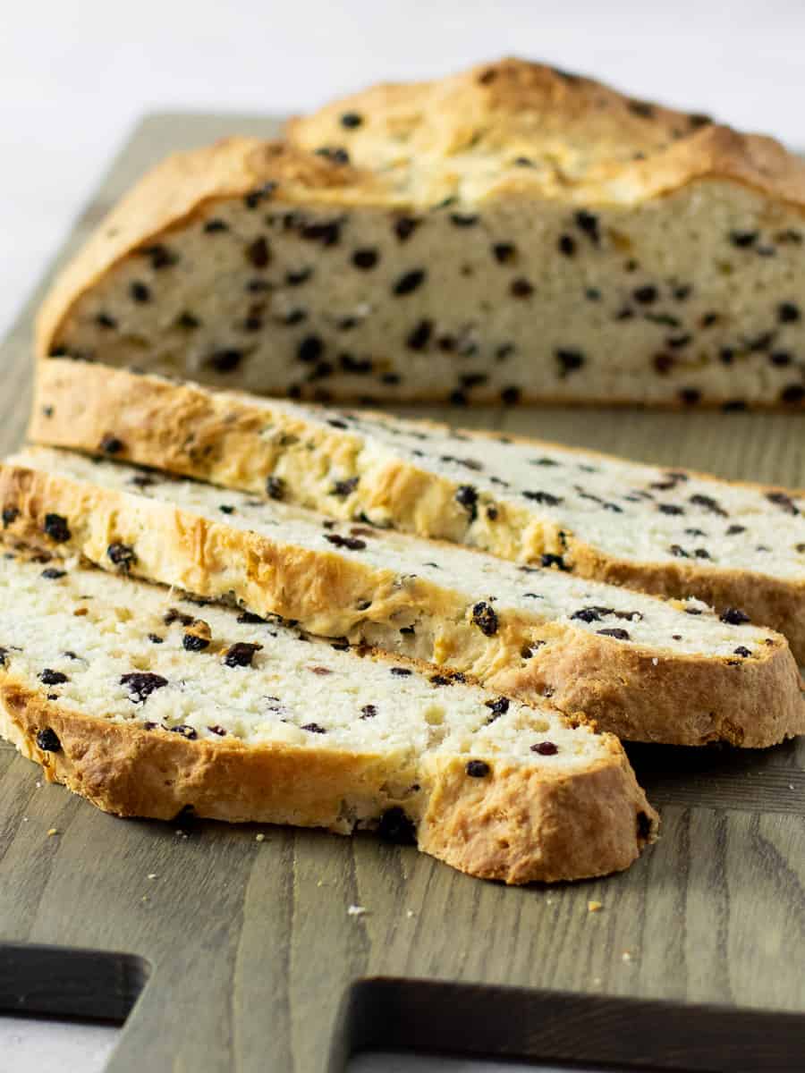 A tall close up picture of sliced bread.