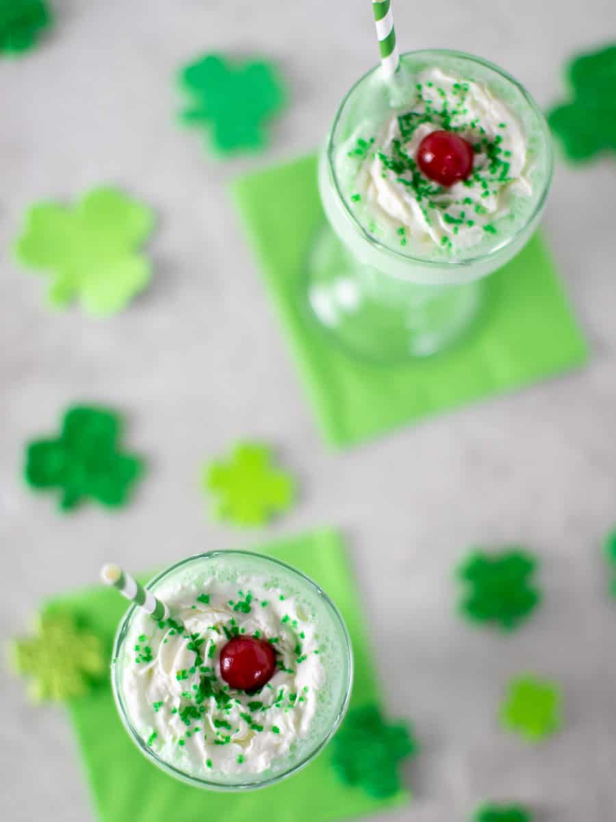 Picture of two glasses of a milkshake viewed from overhead.