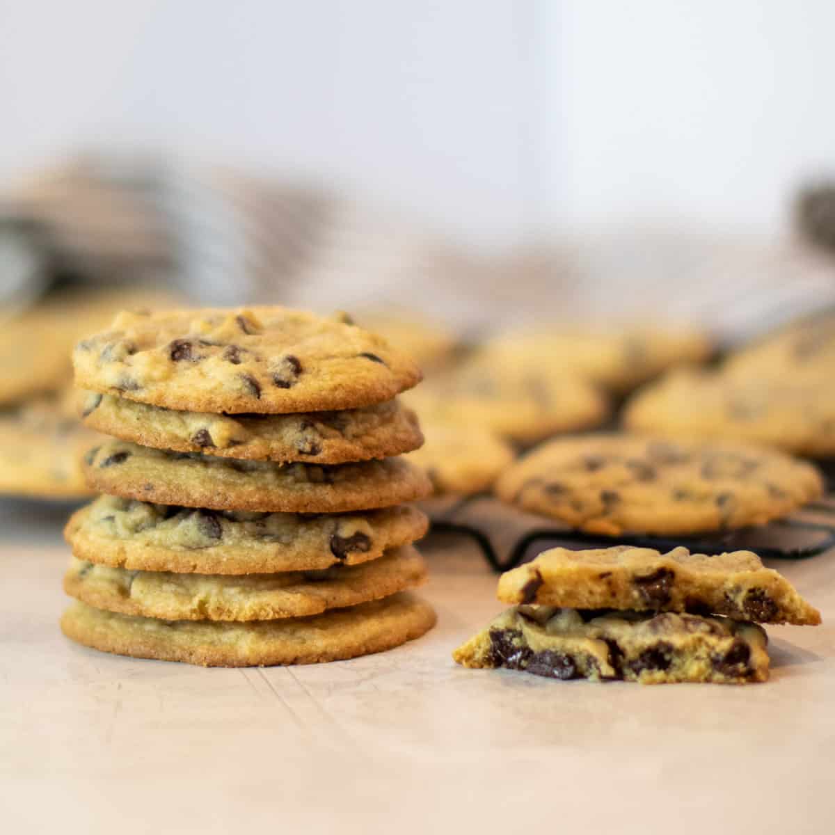 A stack of cookies with one broken in half.