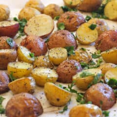 A baking sheet of mini potatoes.