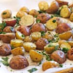 Roasted potatoes garnished with fresh parsley.
