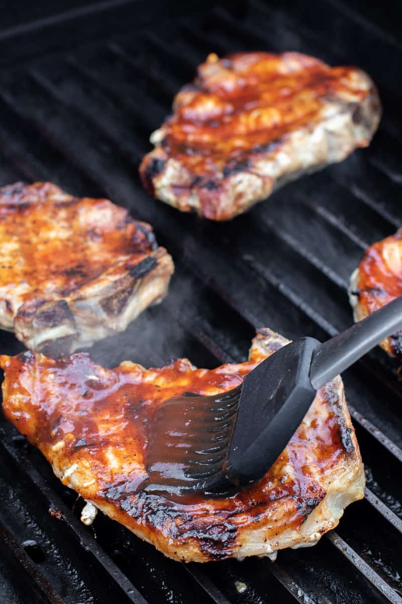 Brush some BBQ sauce on the chops.