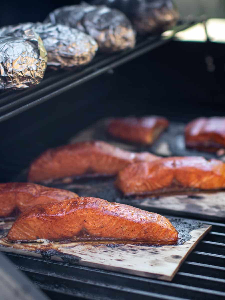 Cooked salmon still on the grill.