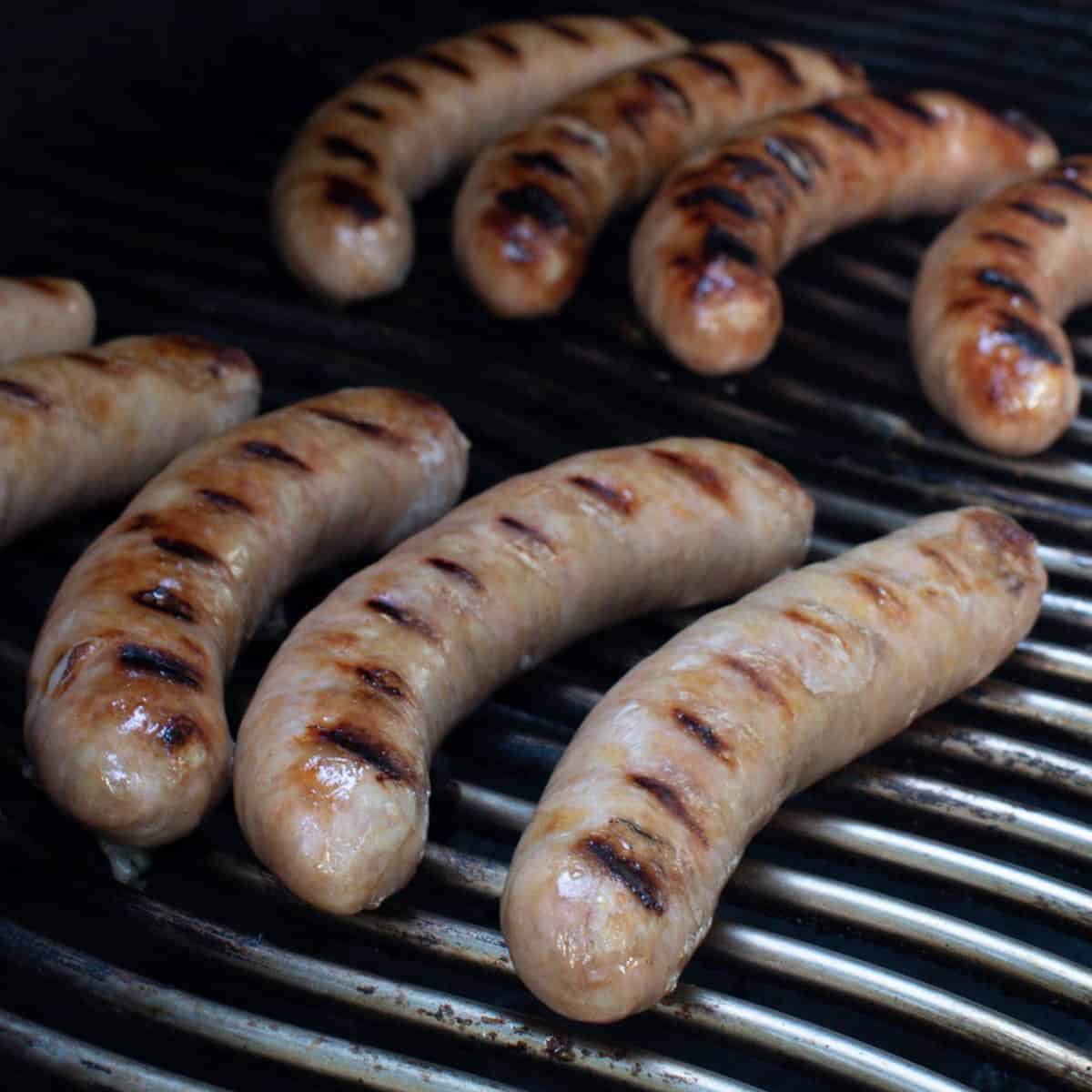 Sausages halfway done cooking.